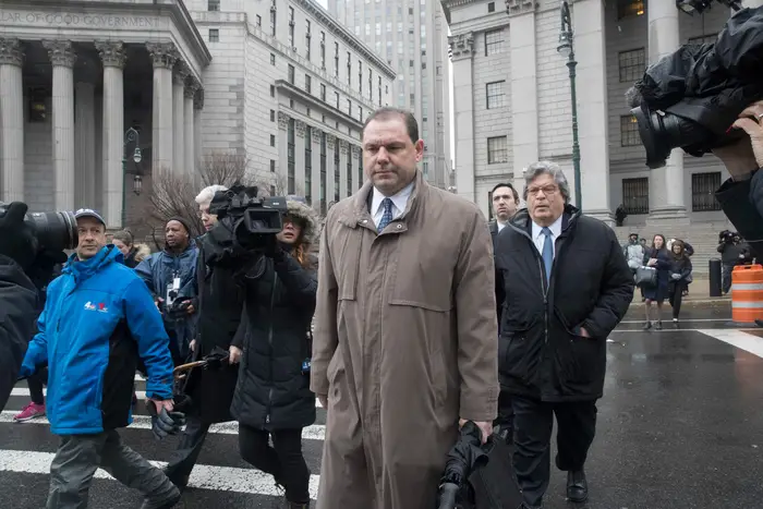 Joseph Percoco, center, a former top aide to former Gov. Andrew Cuomo, leaves U.S. District court in New York City in March 2018. The U.S. Supreme Court is now hearing a case inspired by the court that asks whether government officials can be hit with federal bribery charges.